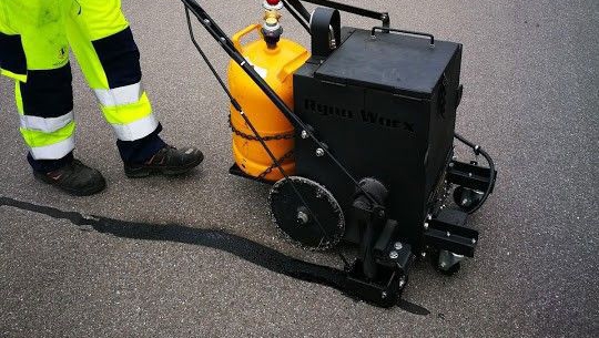 Crack sealing machine in action